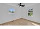Bright bedroom featuring hardwood floors, a modern ceiling fan, and lots of natural light at 926 Natham Dr, Atlanta, GA 30315