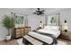 Serene bedroom with natural light, neutral tones, wood accents, and stylish furnishings create a calm retreat at 926 Natham Dr, Atlanta, GA 30315