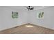 Bright bedroom featuring hardwood floors, a modern ceiling fan, and lots of natural light at 926 Natham Dr, Atlanta, GA 30315