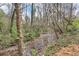 Scenic view of a peaceful creek surrounded by lush greenery, creating a tranquil natural setting at 926 Natham Dr, Atlanta, GA 30315