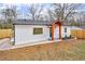 Charming exterior view of home featuring a bright entryway, fenced in yard, large window, and meticulous landscaping at 926 Natham Dr, Atlanta, GA 30315