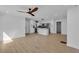 Spacious open-concept living area flowing into a modern kitchen, enhanced by hardwood floors and contemporary fixtures at 926 Natham Dr, Atlanta, GA 30315