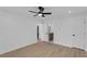 Spacious main bedroom with ceiling fan, ensuite bathroom access, and light hardwood floors at 926 Natham Dr, Atlanta, GA 30315