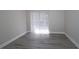 Cozy bedroom with hardwood floors and vertical blinds at 1074 Peachtree Sw Walk # B 216, Atlanta, GA 30309