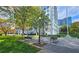 Serene park setting with benches and shade trees near a landmark building at 1074 Peachtree Sw Walk # B 216, Atlanta, GA 30309