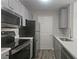 Kitchen featuring stainless appliances and gray cabinets at 1074 Peachtree Sw Walk # B 216, Atlanta, GA 30309