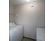 Laundry room with a white washer and dryer set at 1074 Peachtree Sw Walk # B 216, Atlanta, GA 30309