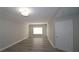 Living room featuring a window and a white door at 1074 Peachtree Sw Walk # B 216, Atlanta, GA 30309