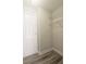 Walk-in closet with shelving and hardwood floors at 1074 Peachtree Sw Walk # B 216, Atlanta, GA 30309