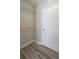 Walk-in closet featuring shelving and hardwood floors at 1074 Peachtree Sw Walk # B 216, Atlanta, GA 30309