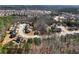 Expansive aerial view of a densely populated residential community with winding roads and well-maintained homes at 134 Jacobs Ln, Loganville, GA 30052