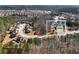 Aerial view of home in a wooded area with surrounding neighborhood visible at 134 Jacobs Ln, Loganville, GA 30052