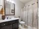 Well-maintained bathroom features a single sink vanity and shower with decorative curtain at 134 Jacobs Ln, Loganville, GA 30052