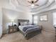 Bedroom with carpet and a tray ceiling and a ceiling fan at 134 Jacobs Ln, Loganville, GA 30052