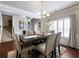 Bright dining room featuring a table with seating for six and large windows adorned with shutters at 134 Jacobs Ln, Loganville, GA 30052