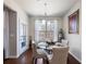 Eat-in dining area boasts a glass table, four chairs, and natural light from a large window at 134 Jacobs Ln, Loganville, GA 30052