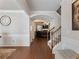 Inviting foyer with hardwood floors, classic wainscoting, and an open view of the staircase and living area at 134 Jacobs Ln, Loganville, GA 30052