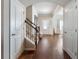 Welcoming foyer featuring wood floors, staircase, and ample natural light at 134 Jacobs Ln, Loganville, GA 30052