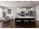 Modern kitchen featuring granite countertops, stainless steel appliances, a kitchen island, and an adjacent dining area at 134 Jacobs Ln, Loganville, GA 30052