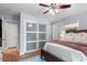 Bright bedroom featuring hardwood floors, large closets, and lots of natural light at 2793 Frontier Trl, Atlanta, GA 30341