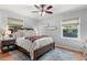 Comfortable bedroom with hardwood floors, neutral colors, and large windows at 2793 Frontier Trl, Atlanta, GA 30341