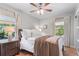 Cozy bedroom with hardwood floors, ceiling fan, and abundant natural light at 2793 Frontier Trl, Atlanta, GA 30341