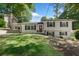 Charming two-story home featuring a well-manicured lawn, a covered side-entry carport, and classic shutters at 2793 Frontier Trl, Atlanta, GA 30341