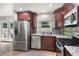 Updated kitchen featuring stainless steel appliances, granite countertops, and a stylish backsplash at 2793 Frontier Trl, Atlanta, GA 30341