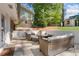 Relaxing outdoor patio area with comfortable seating, a fire pit table, and a well-maintained yard at 2793 Frontier Trl, Atlanta, GA 30341