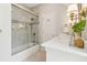 Bathroom featuring a shower over tub and marble countertop at 320 Morganshire Pl, Atlanta, GA 30350