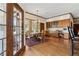 Charming dining area adjacent to the kitchen with hardwood floors and ample natural light at 320 Morganshire Pl, Atlanta, GA 30350