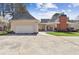 Back exterior and detached garage with well-maintained lawn and driveway at 320 Morganshire Pl, Atlanta, GA 30350