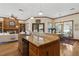 Open kitchen with granite counters and stainless appliances flows into the breakfast area at 320 Morganshire Pl, Atlanta, GA 30350