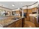 Gourmet kitchen features granite counters, stainless appliances and wooden cabinetry at 320 Morganshire Pl, Atlanta, GA 30350