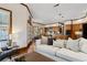 Open-concept living room with hardwood floors connecting to a stylish kitchen and dining area at 320 Morganshire Pl, Atlanta, GA 30350