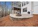 This home has a backyard featuring a patio, fire pit, and lush wooded surroundings at 327 Horseshoe Bend Bnd, Woodstock, GA 30189