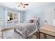 Bedroom with hardwood floors, a ceiling fan, and a large window at 327 Horseshoe Bend Bnd, Woodstock, GA 30189