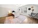 Bedroom with hardwood floors, a fan, a large window, and neutral colored walls at 327 Horseshoe Bnd, Woodstock, GA 30189