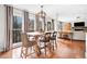 Bright dining area featuring hardwood floors, large windows, and access to an open concept floor plan at 327 Horseshoe Bnd, Woodstock, GA 30189