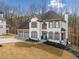 Charming two-story home with a three car garage and beautiful landscaping in a wooded neighborhood at 327 Horseshoe Bnd, Woodstock, GA 30189