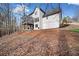 This home features a back exterior and landscaping at 327 Horseshoe Bend Bnd, Woodstock, GA 30189