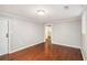 Basement rec room with light-colored walls and wood floors at 959 Frontier Sw Trl, Marietta, GA 30060