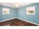 Cozy bedroom with hardwood floors, light blue walls and natural lighting at 959 Frontier Sw Trl, Marietta, GA 30060