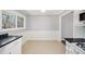 Open kitchen area with tile flooring, white wainscotting, and natural light at 959 Frontier Sw Trl, Marietta, GA 30060