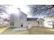 Two-story home featuring a spacious backyard with a concrete patio, perfect for outdoor entertaining at 2357 Wellborn Hills Pl, Lithonia, GA 30058