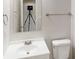 Bathroom boasts neutral color palette, modern fixtures, and a vanity at 2357 Wellborn Hills Pl, Lithonia, GA 30058