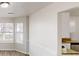 Bright dining area with a view into the kitchen and living room at 2357 Wellborn Hills Pl, Lithonia, GA 30058