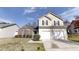 Charming two-story home with a well-maintained lawn and two-car garage at 2357 Wellborn Hills Pl, Lithonia, GA 30058