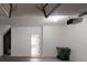 Empty garage with a concrete floor and a trash can at 2357 Wellborn Hills Pl, Lithonia, GA 30058