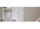 Bright hallway with light wood floors and white doors at 2357 Wellborn Hills Pl, Lithonia, GA 30058